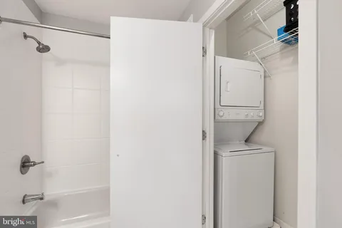 a bathroom with a shower and a shower