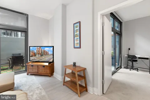 a living room with furniture and a window
