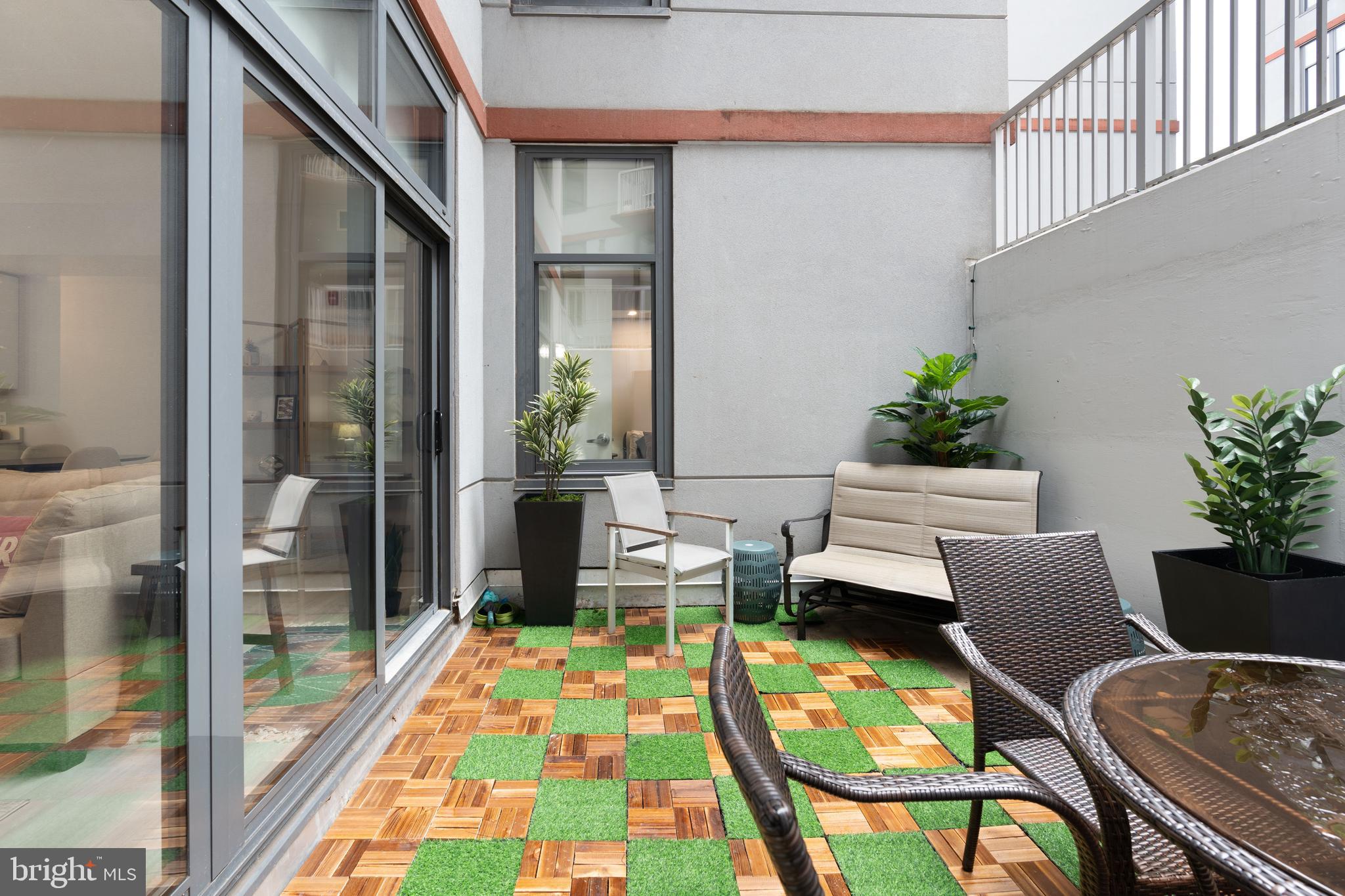 2120 Vermont Avenue Northwest, Unit 17 Washington, DC 20001 - Photo 9 of 35 a balcony with furniture and a potted plant