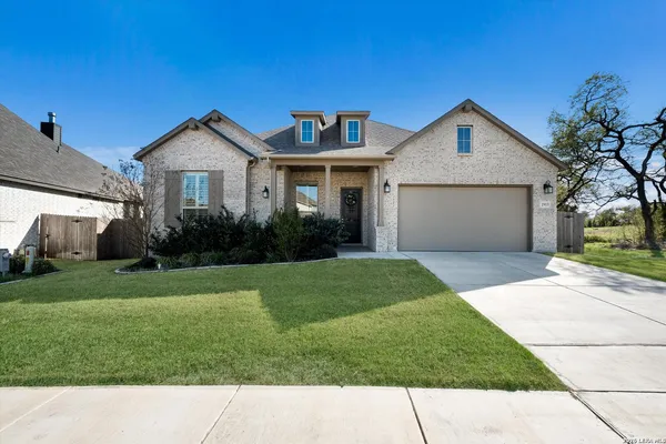 a view of a yard in front view of a house