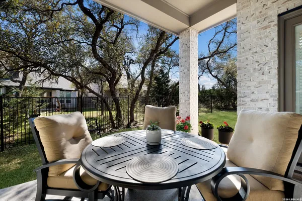 a table and chairs in front of a building