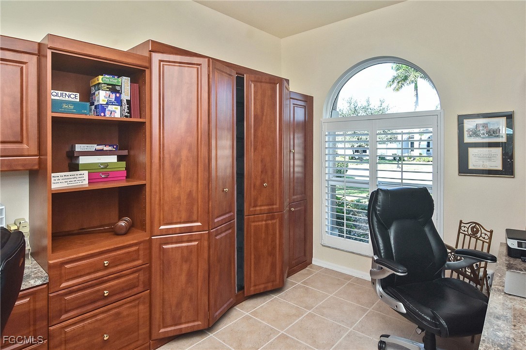 11131 Wine Palm Road Fort Myers, FL 33966 - Photo 23 of 48 a view of a workspace with furniture and a window