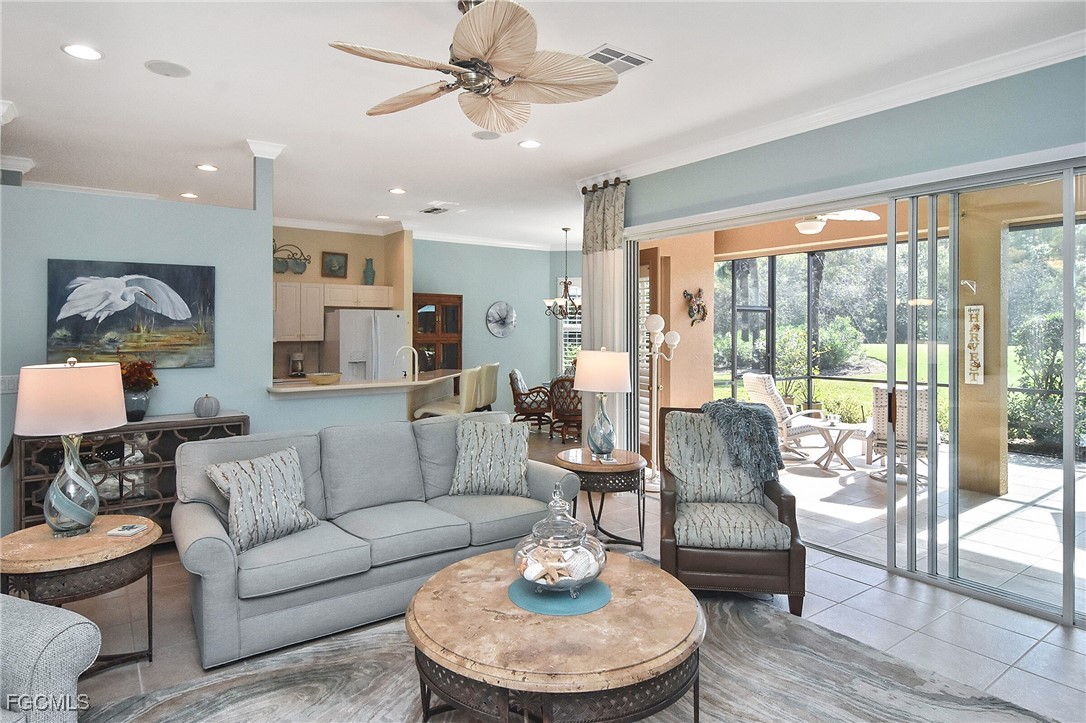 11131 Wine Palm Road Fort Myers, FL 33966 - Photo 25 of 48 a living room with furniture and a large window