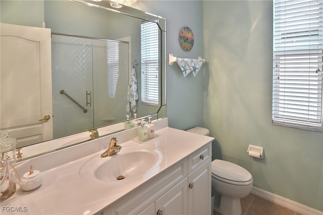 11131 Wine Palm Road Fort Myers, FL 33966 - Photo 34 of 48 a bathroom with a sink and a toilet