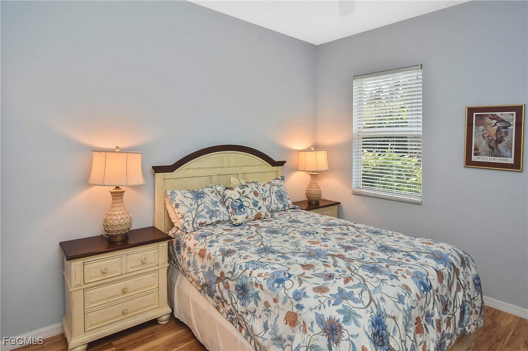 11131 Wine Palm Road Fort Myers, FL 33966 - Photo 36 of 48 a bedroom with a bed and a dresser