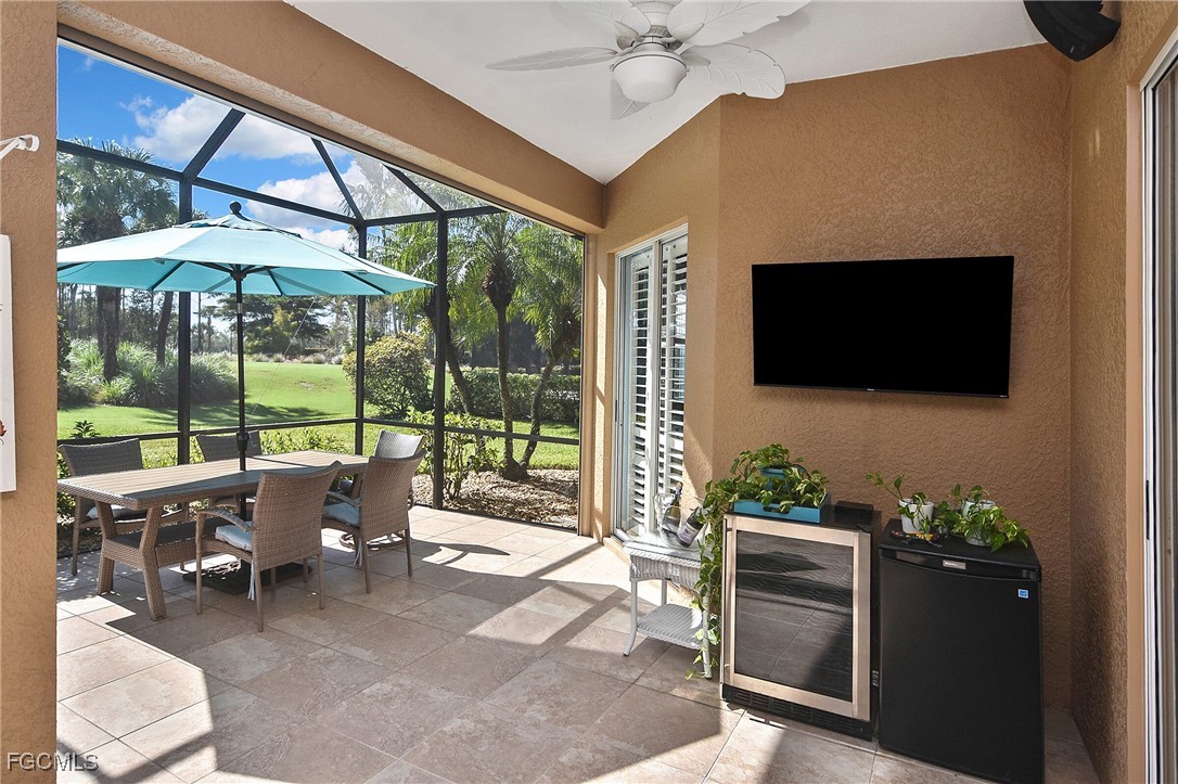 11131 Wine Palm Road Fort Myers, FL 33966 - Photo 41 of 48 a living room with patio furniture and a flat screen tv