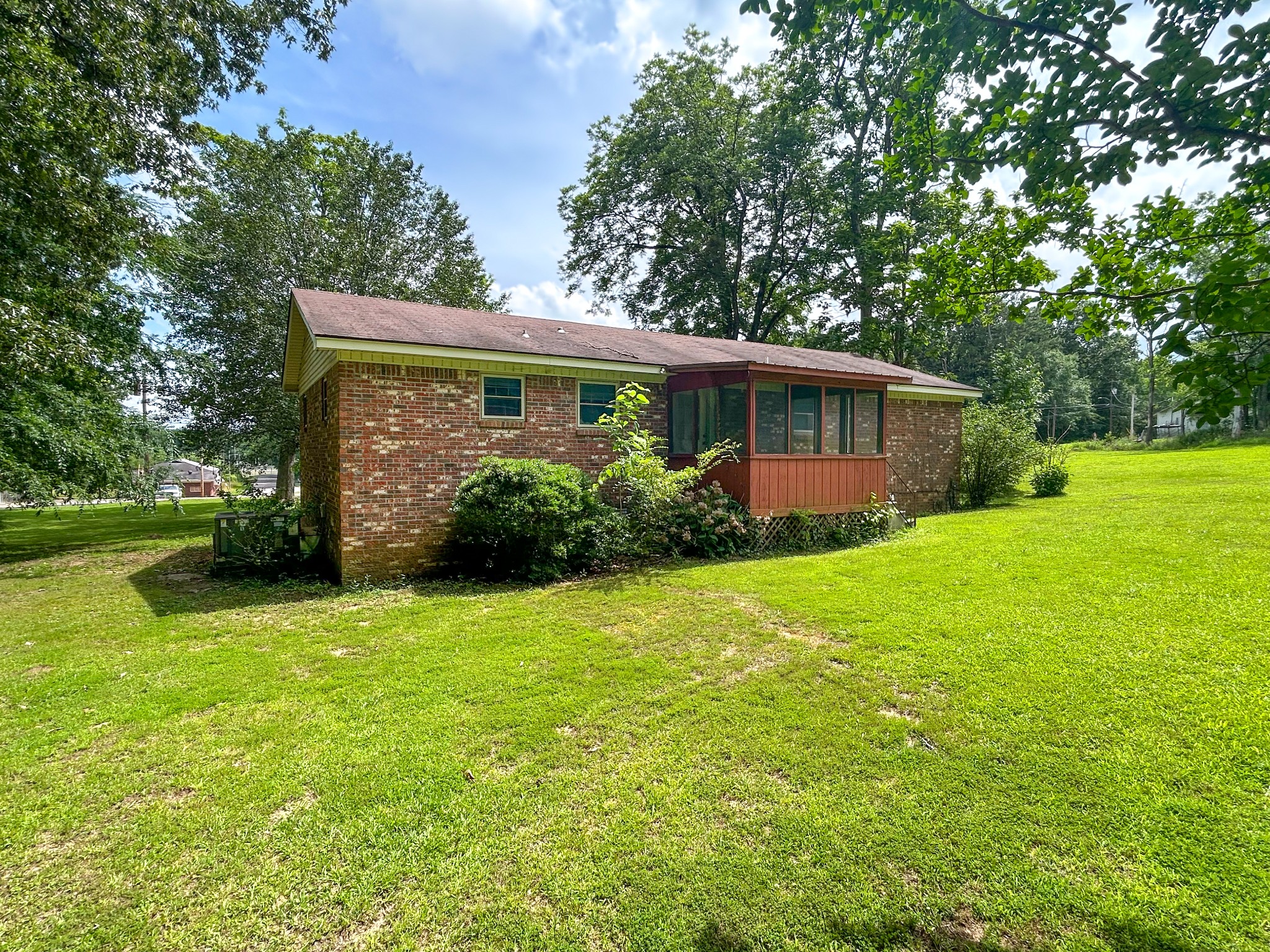 181 Jones Street Huntingdon, TN 38344 - Photo 6 of 21 a view of a house with backyard and garden