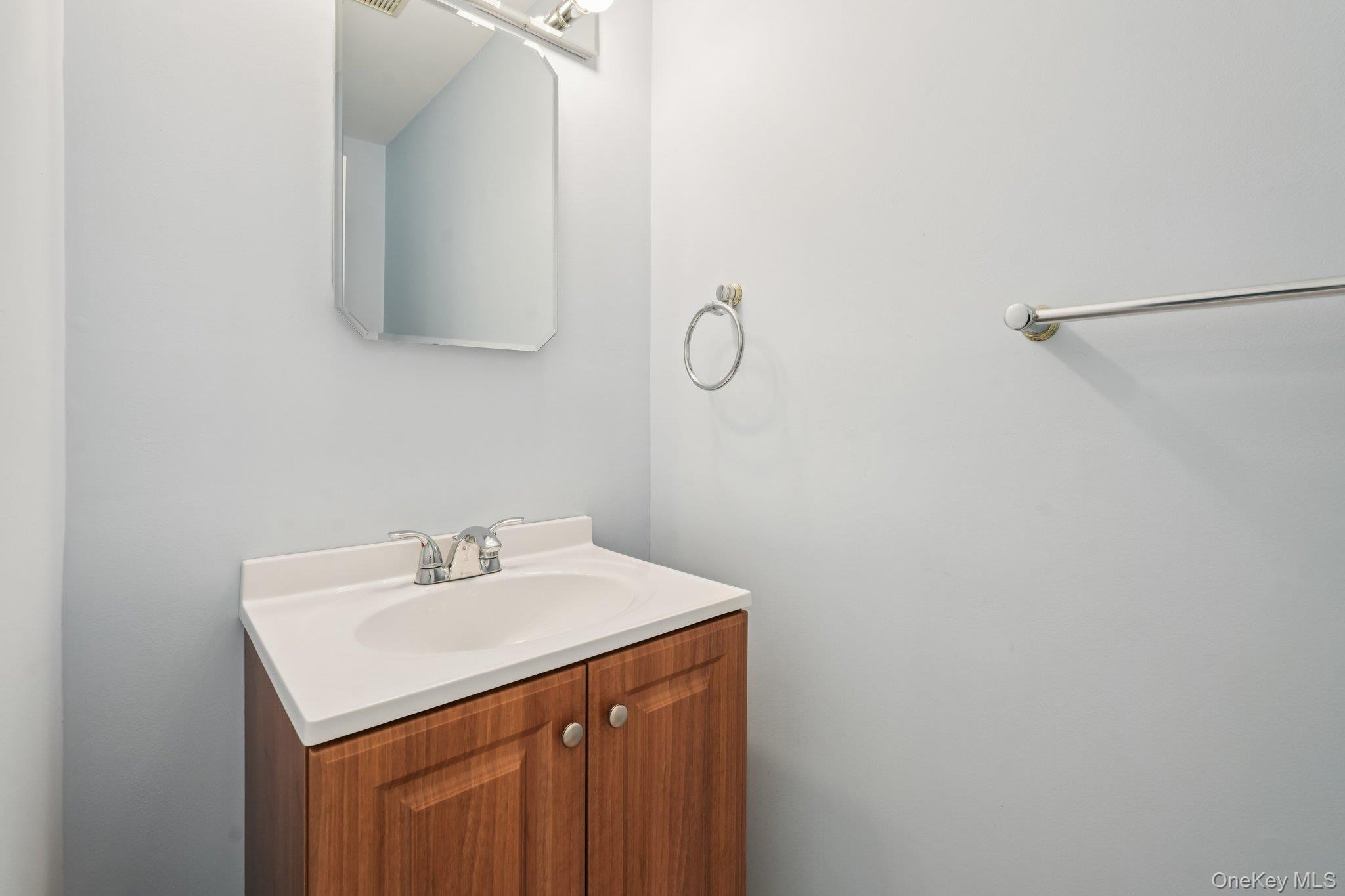 23 Oriole Road New City, NY 10956 - Photo 17 of 43 a bathroom with a sink and a mirror