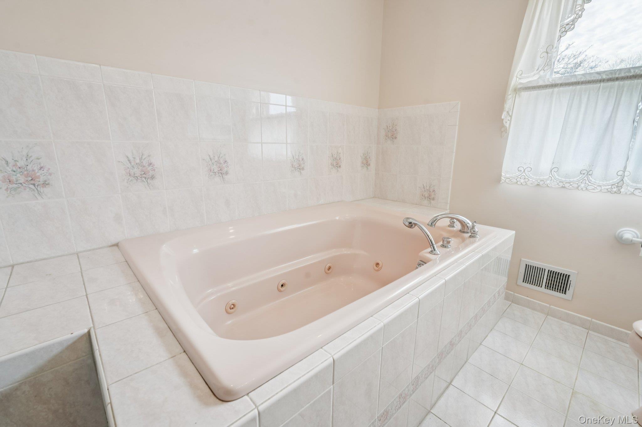 23 Oriole Road New City, NY 10956 - Photo 21 of 43 a white bath tub sitting in a bathroom