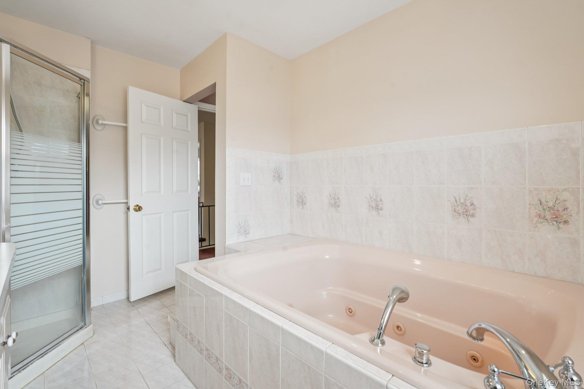 23 Oriole Road New City, NY 10956 - Photo 22 of 43 a bathroom with a tub and shower