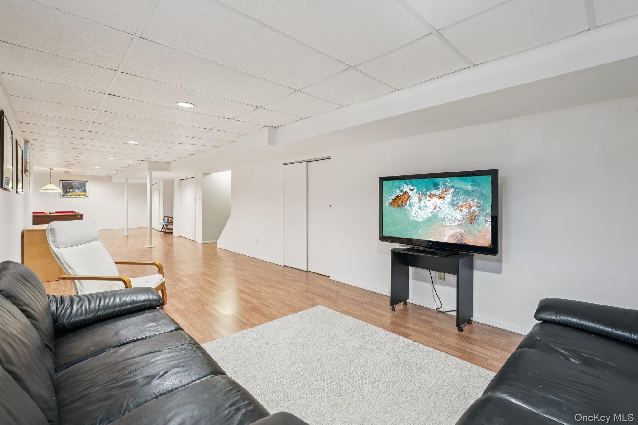 23 Oriole Road New City, NY 10956 - Photo 29 of 43 a living room with furniture and a flat screen tv