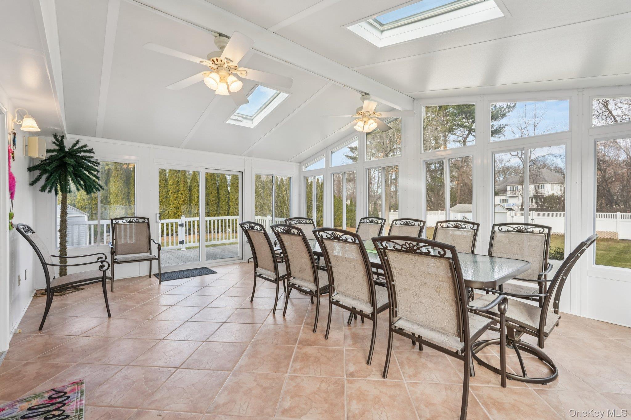 23 Oriole Road New City, NY 10956 - Photo 3 of 43 a dining room with furniture a large window and potted plants
