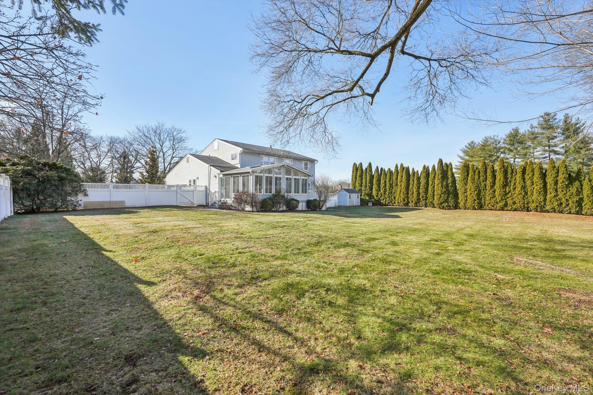 23 Oriole Road New City, NY 10956 - Photo 33 of 43 a view of swimming pool with outdoor seating and house in the background