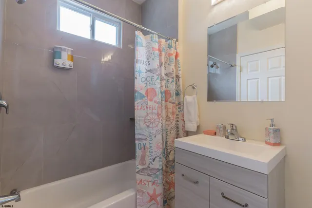 a bathroom with a sink and a bathtub