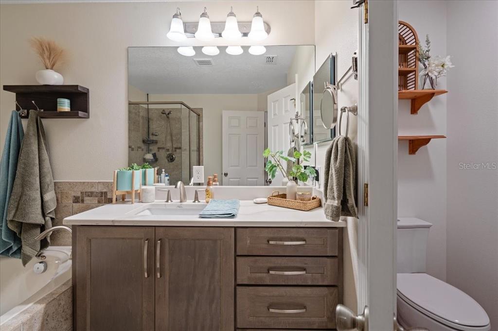 3271 Titanic Circle, Unit 39 Indialantic, FL 32903 - Photo 33 of 60 a bathroom with a sink vanity mirror and toilet