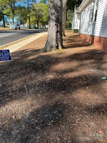 a kitchen with a stove and a wooden cabinets