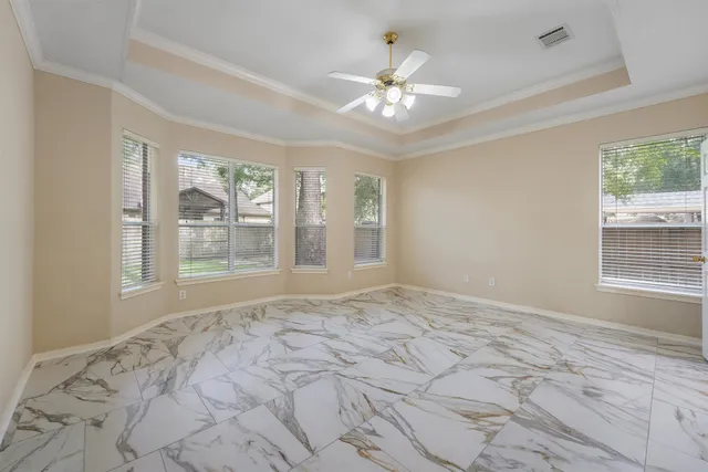 a view of an empty room with a window