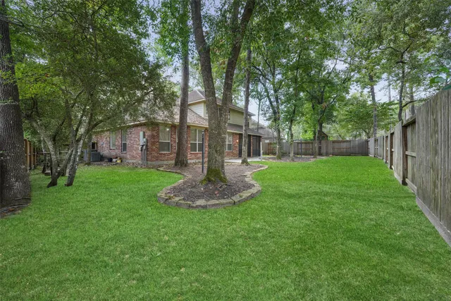a garden with trees in front of it