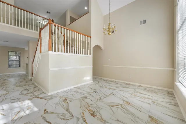 a view of a hallway view with staircase