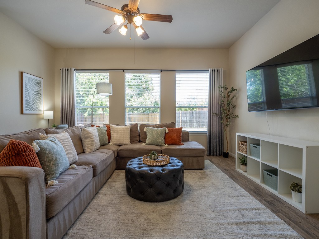 a living room with furniture and a flat screen tv