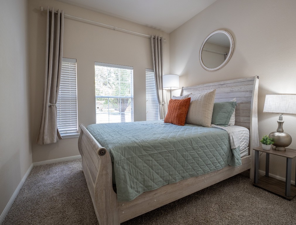 11620 Larch Valley Drive Austin, TX 78754 - Photo 18 of 24 a bedroom with a bed and window