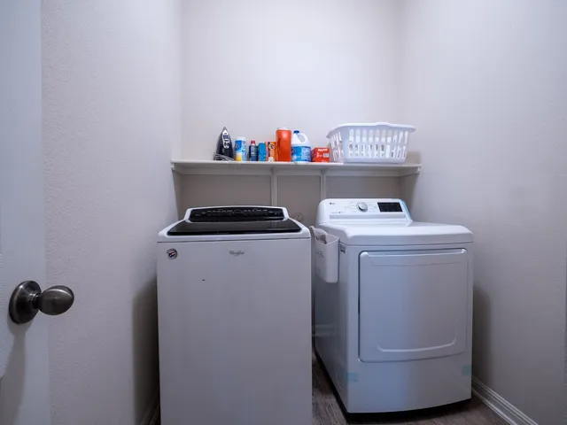 a view of a house with backyard porch and sitting area