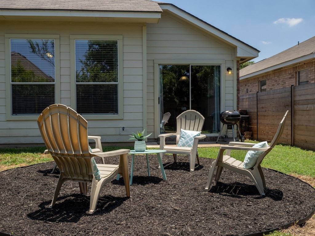 11620 Larch Valley Drive Austin, TX 78754 - Photo 22 of 24 a view of a two chairs in a backyard