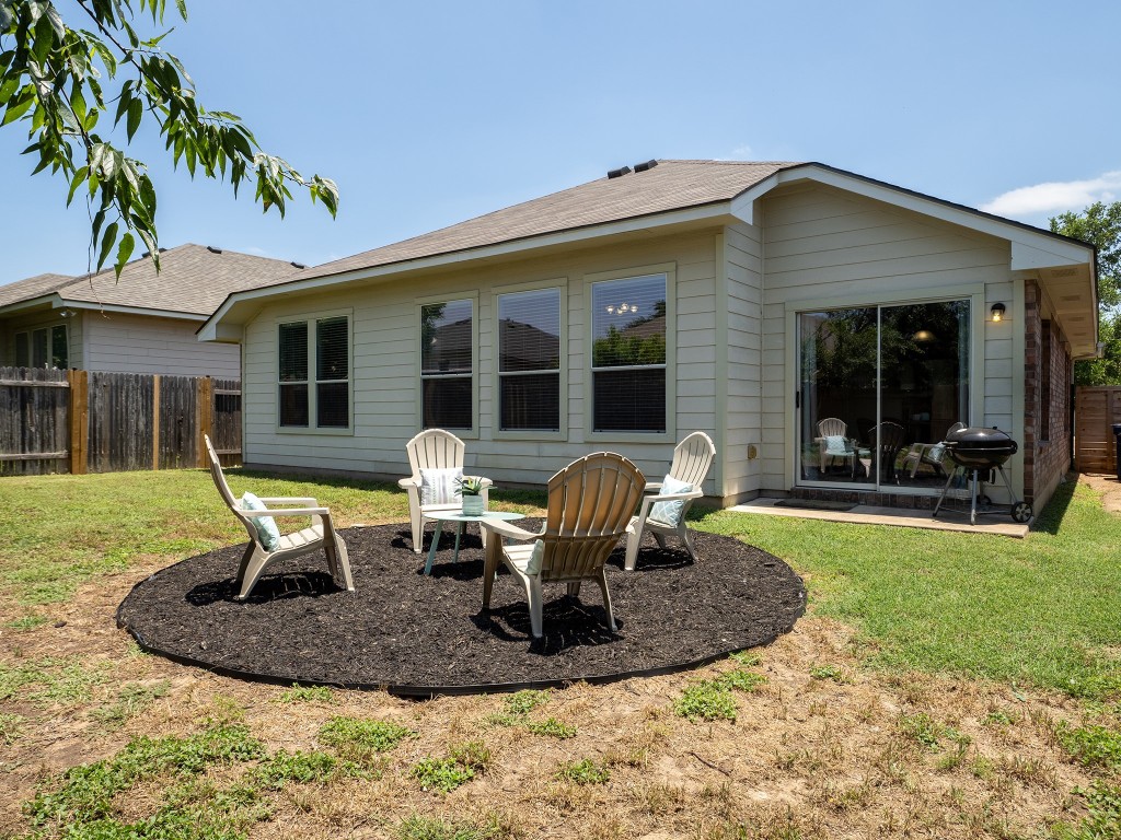 11620 Larch Valley Drive Austin, TX 78754 - Photo 23 of 24 a view of a house with backyard porch and sitting area