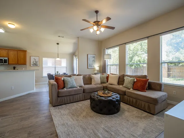 a living room with furniture and a large window