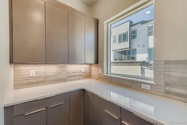 a view of a kitchen sink and a window