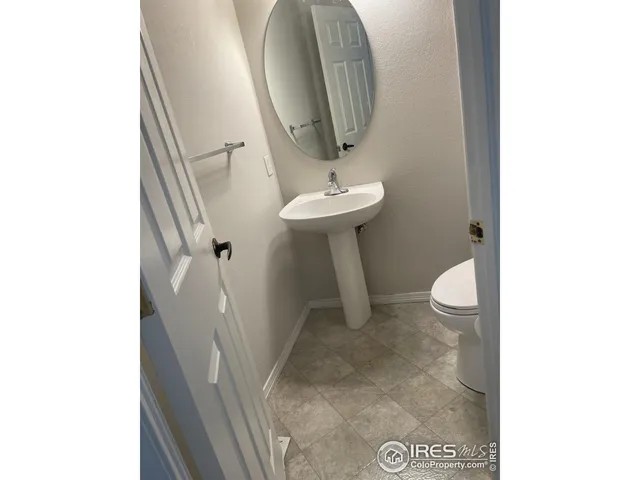 a bathroom with a sink and mirror