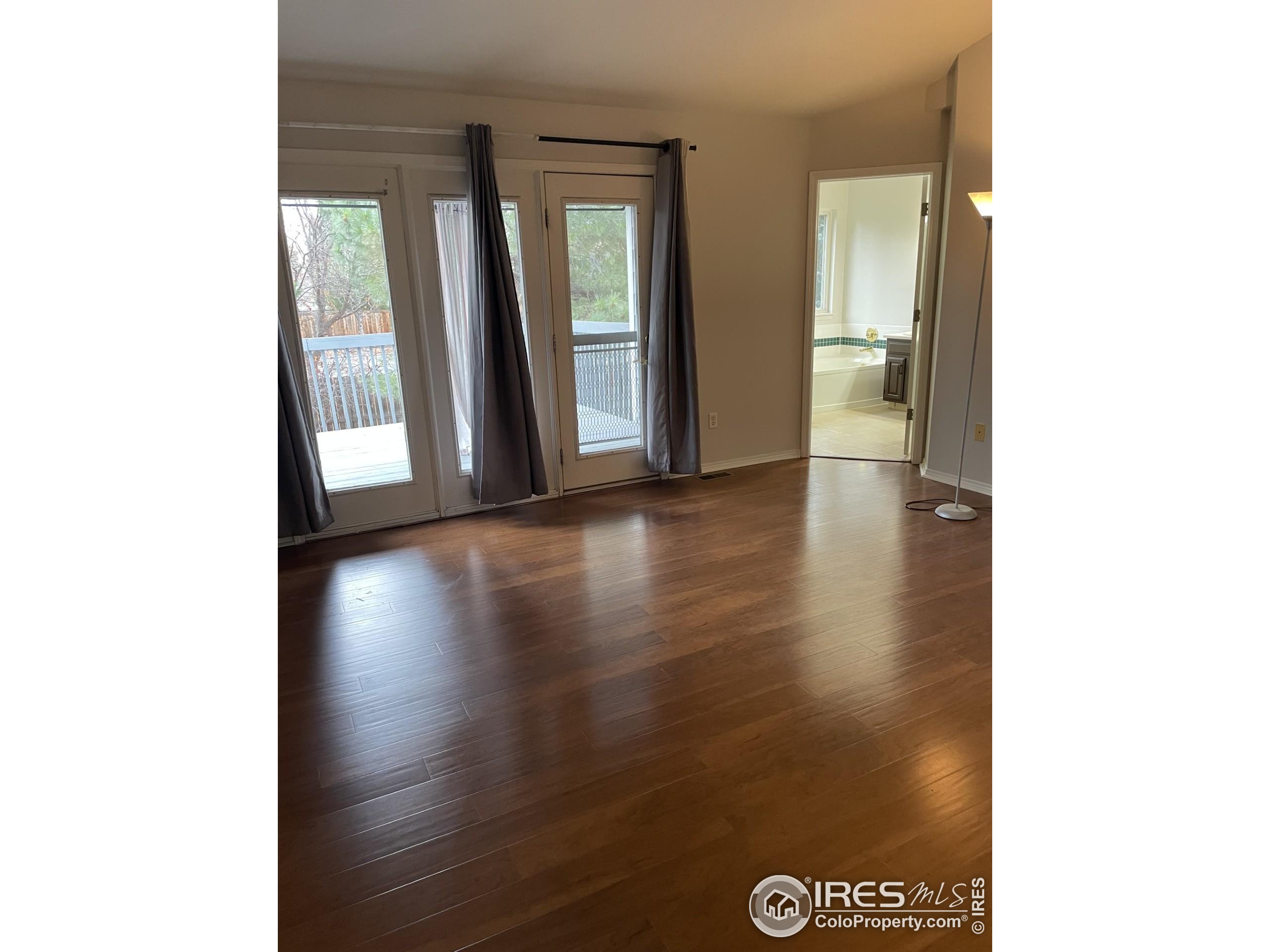 613 Rider Ridge Drive Longmont, CO 80504 - Photo 18 of 34 a view of an entryway with wooden floor