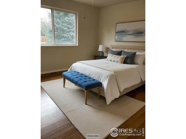 a bed room with a bed and a window