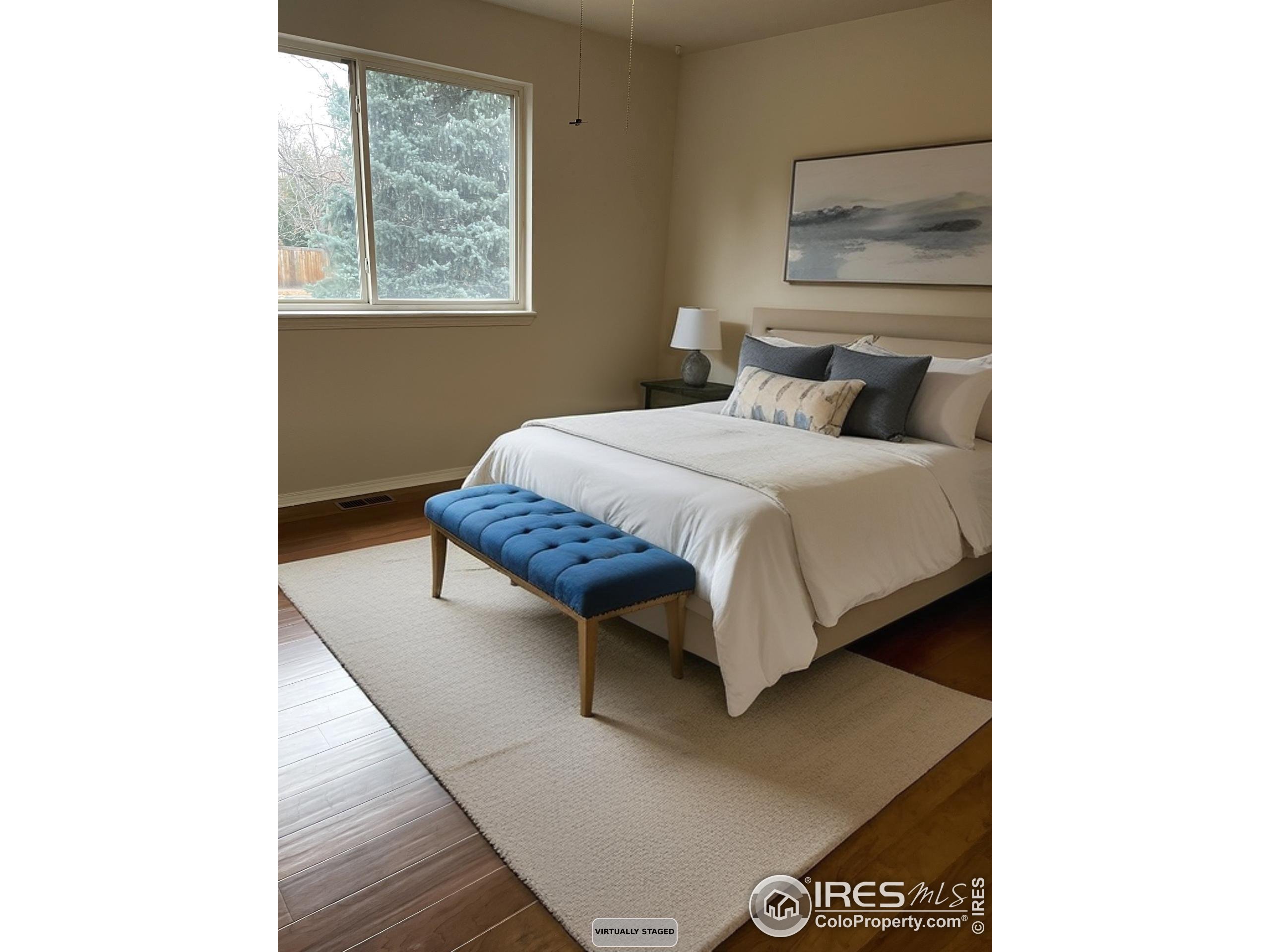 613 Rider Ridge Drive Longmont, CO 80504 - Photo 23 of 34 a bed room with a bed and a window