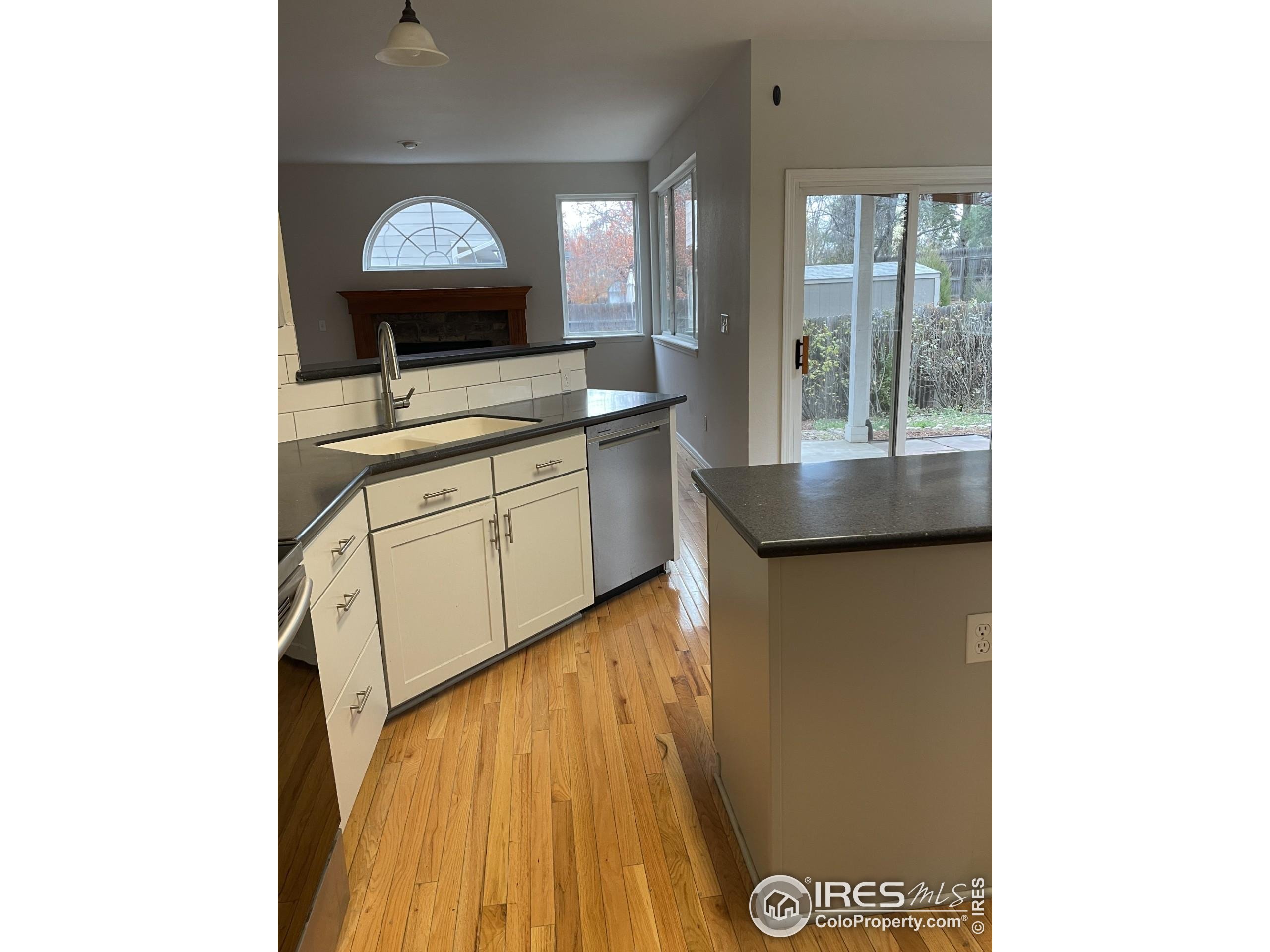 613 Rider Ridge Drive Longmont, CO 80504 - Photo 8 of 34 a kitchen with sink and window