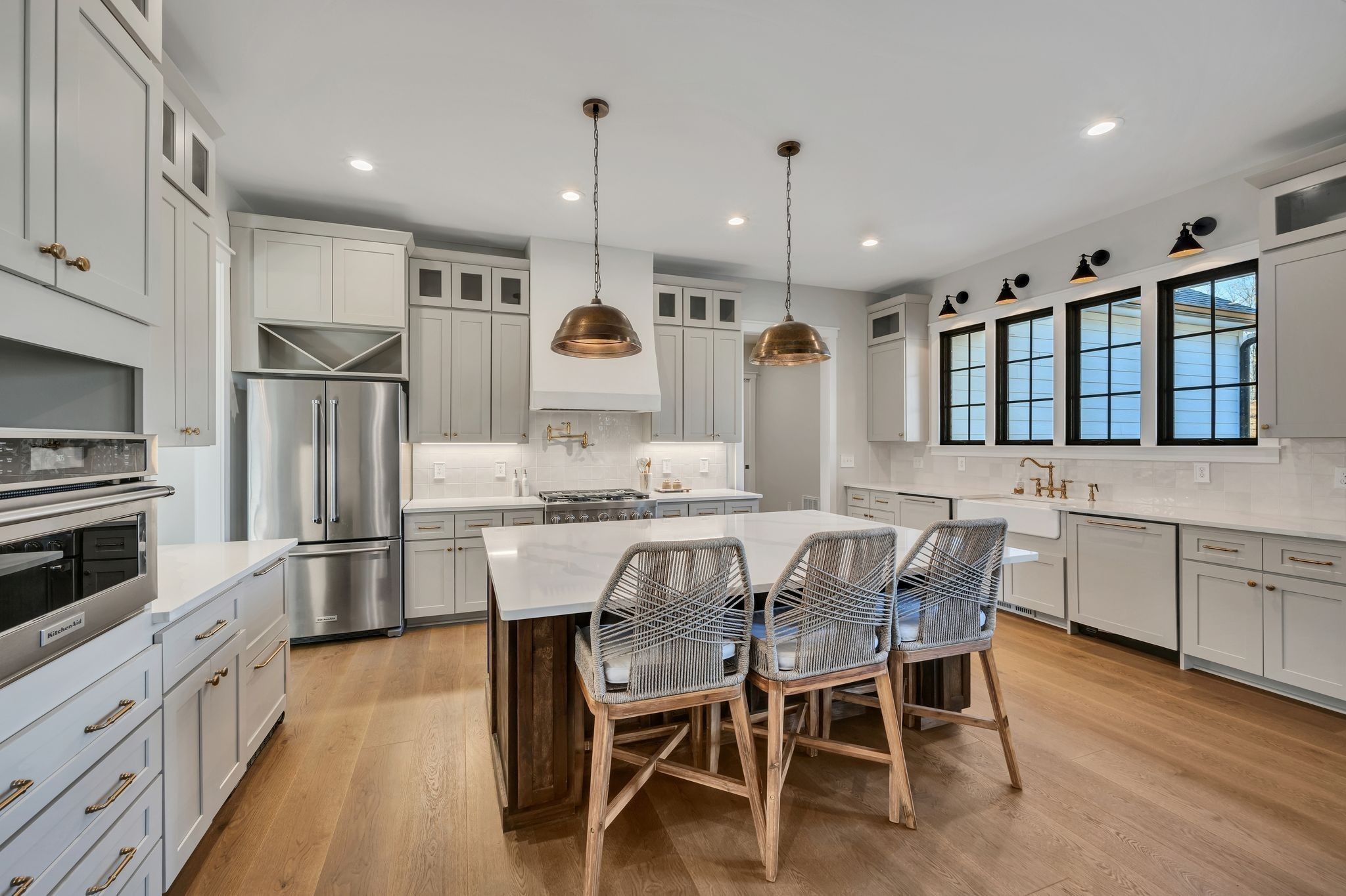 673 Billy Wynn Road Dickson, TN 37055 - Photo 13 of 56 a kitchen with stainless steel appliances kitchen island granite countertop a table chairs sink and cabinets
