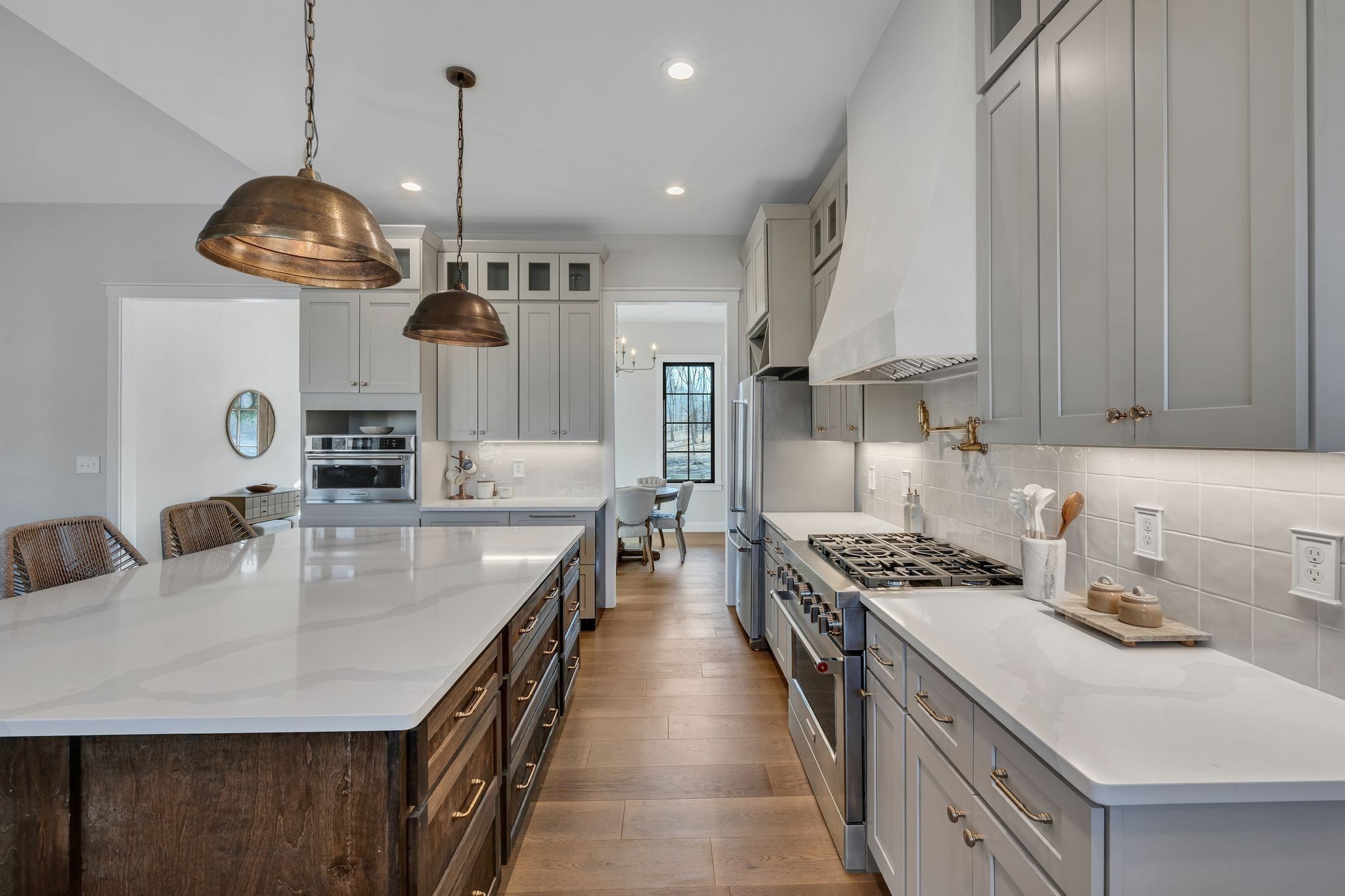 673 Billy Wynn Road Dickson, TN 37055 - Photo 16 of 56 a kitchen with stainless steel appliances granite countertop a stove a sink a refrigerator and a wooden cabinets