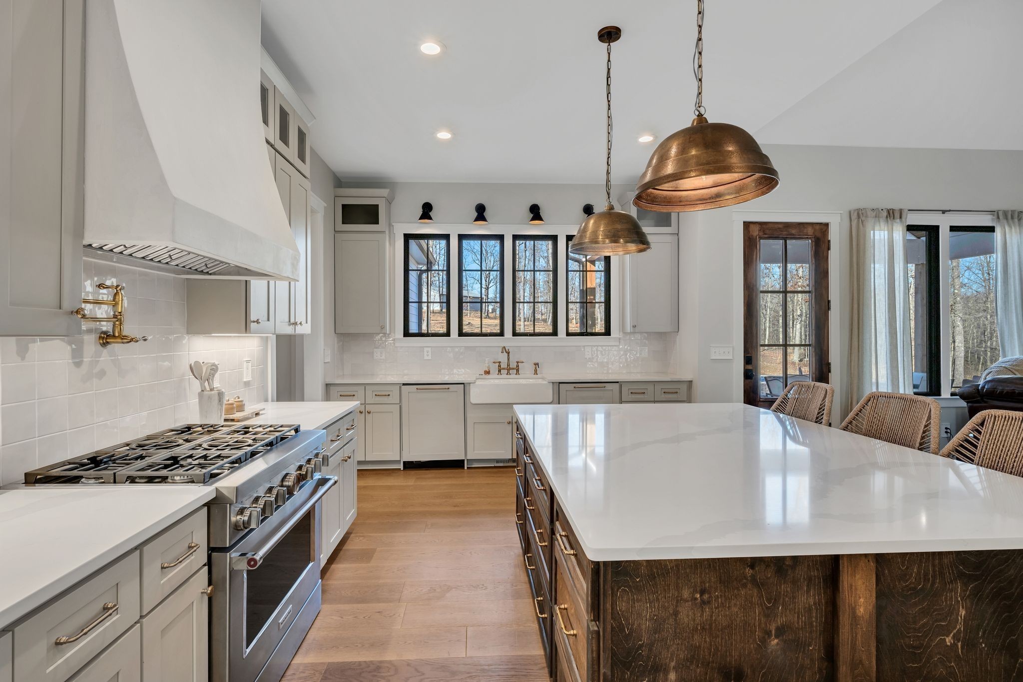 673 Billy Wynn Road Dickson, TN 37055 - Photo 18 of 56 a kitchen with stainless steel appliances granite countertop a stove a sink a refrigerator white wooden cabinets and couches