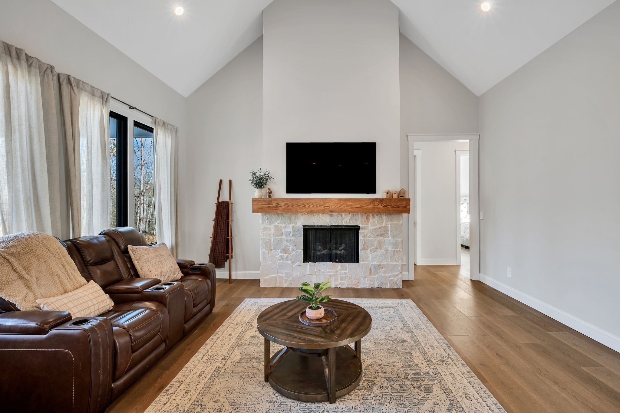 673 Billy Wynn Road Dickson, TN 37055 - Photo 19 of 56 a living room with furniture a flat screen tv and a fireplace