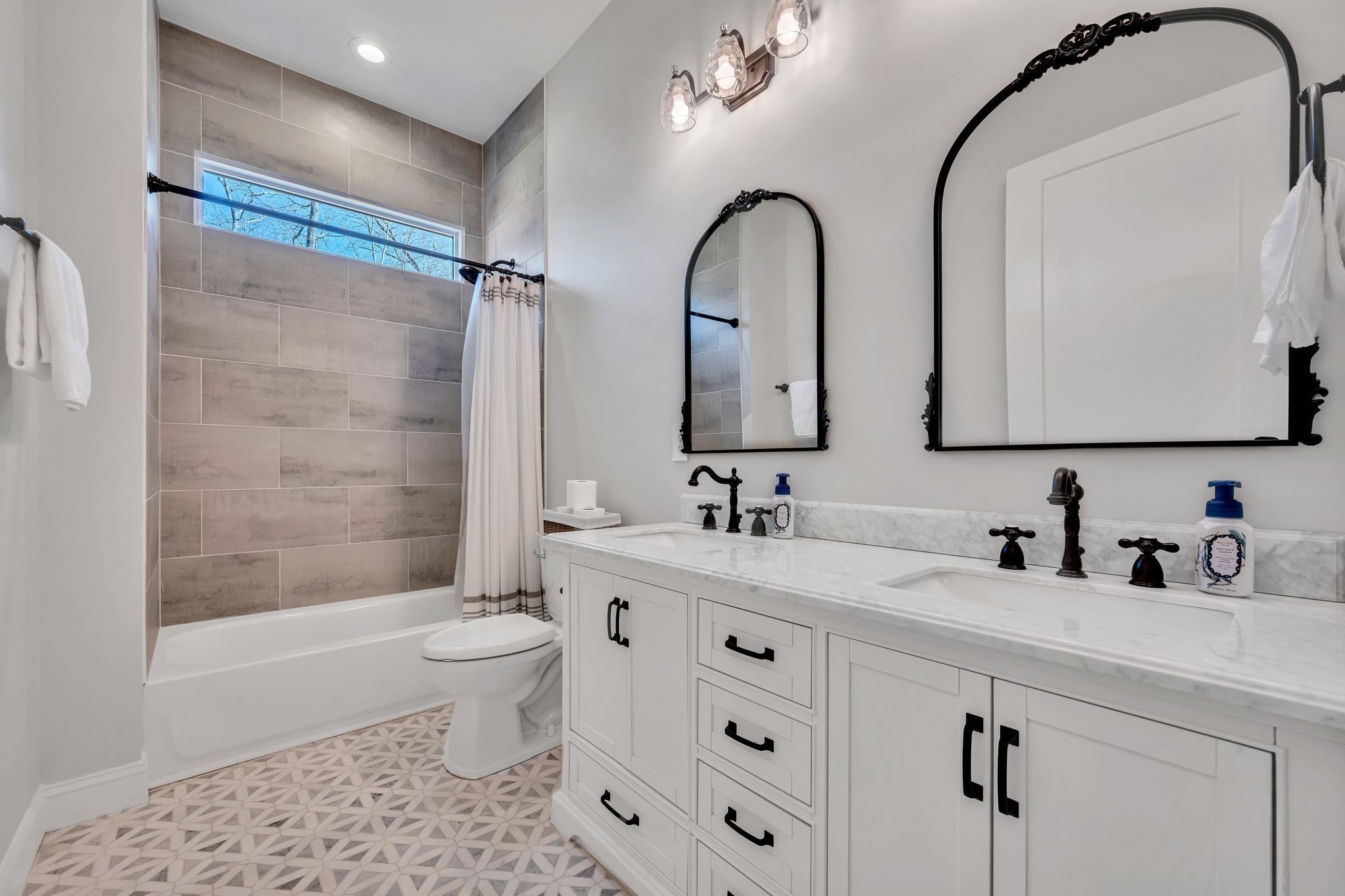 673 Billy Wynn Road Dickson, TN 37055 - Photo 37 of 56 a bathroom with a double vanity sink toilet mirror and shower