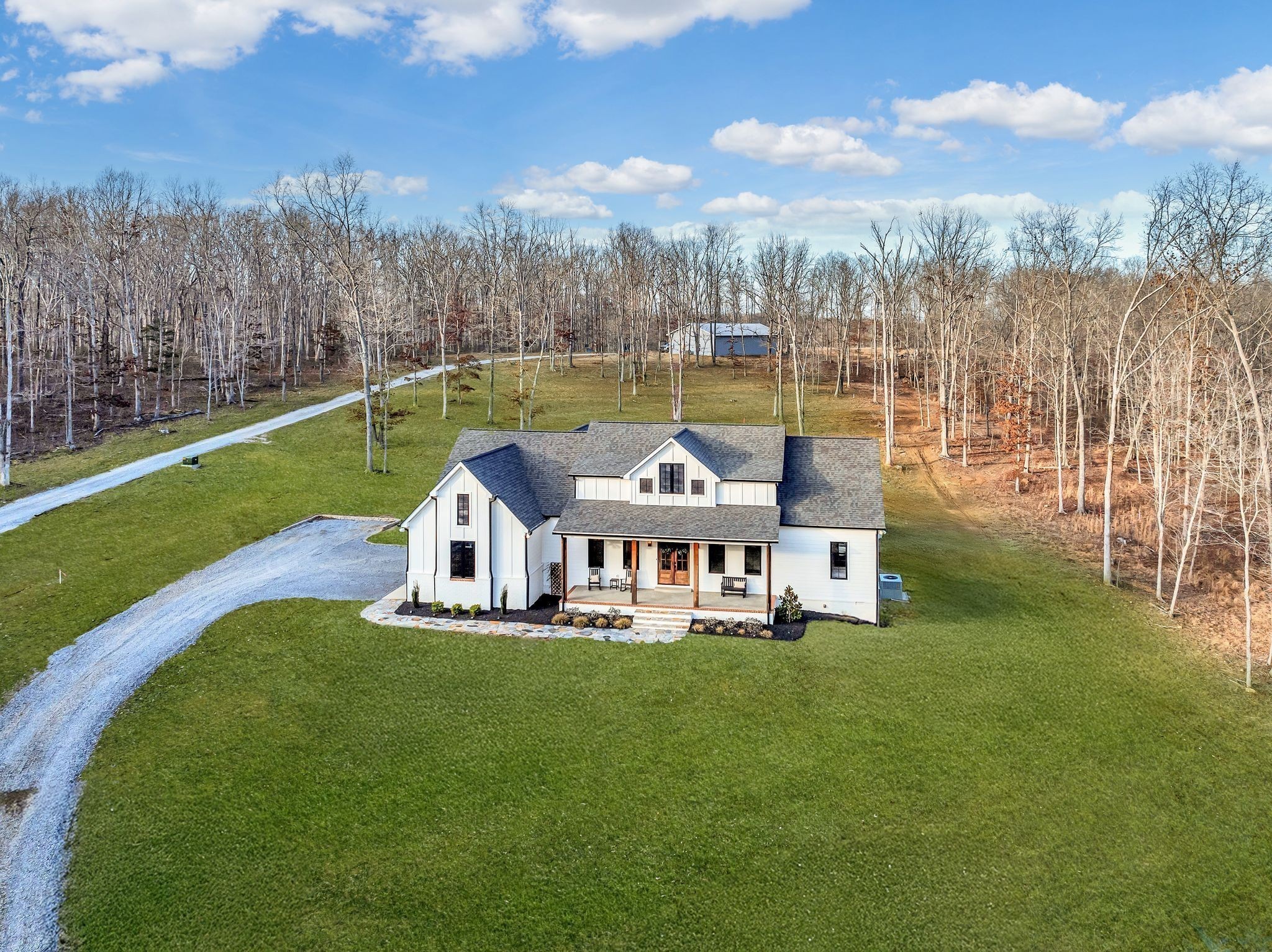 673 Billy Wynn Road Dickson, TN 37055 - Photo 41 of 56 a view of a house with a yard and sitting area