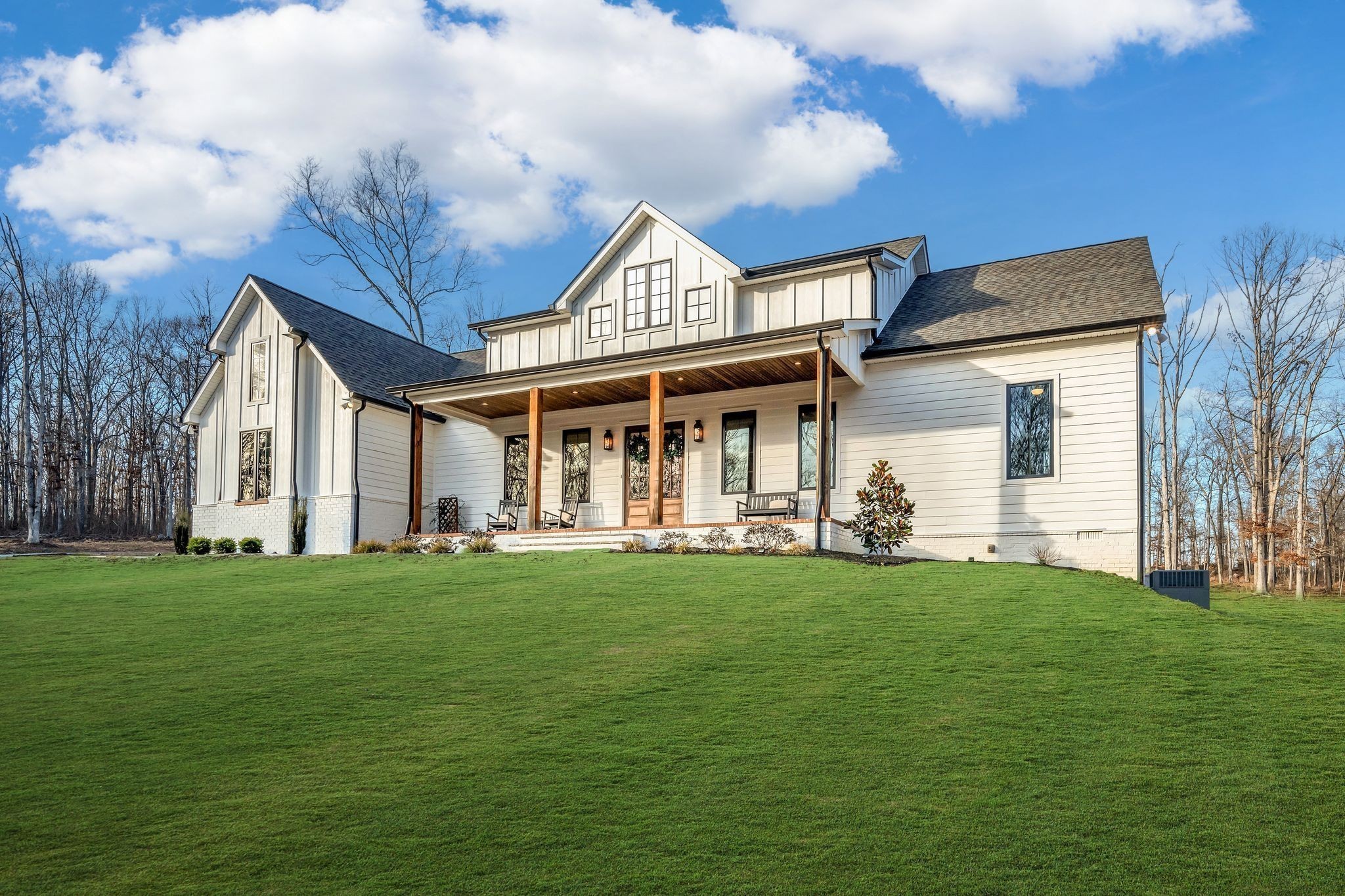 673 Billy Wynn Road Dickson, TN 37055 - Photo 45 of 56 a view of a white house with a big yard and large trees