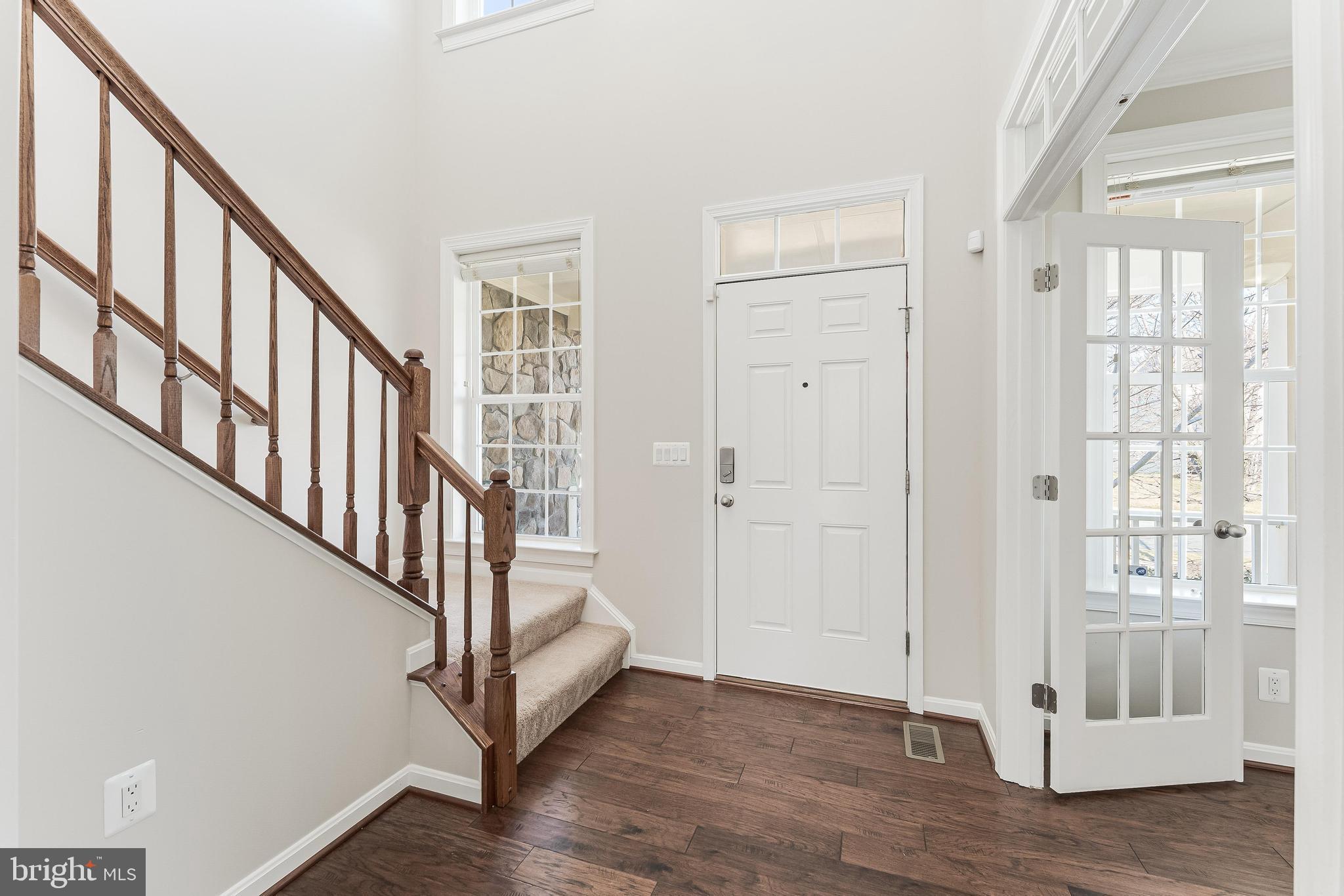 18747 Pier Trail Drive Triangle, VA 22172 - Photo 18 of 84 a view of an entryway with wooden floor and door