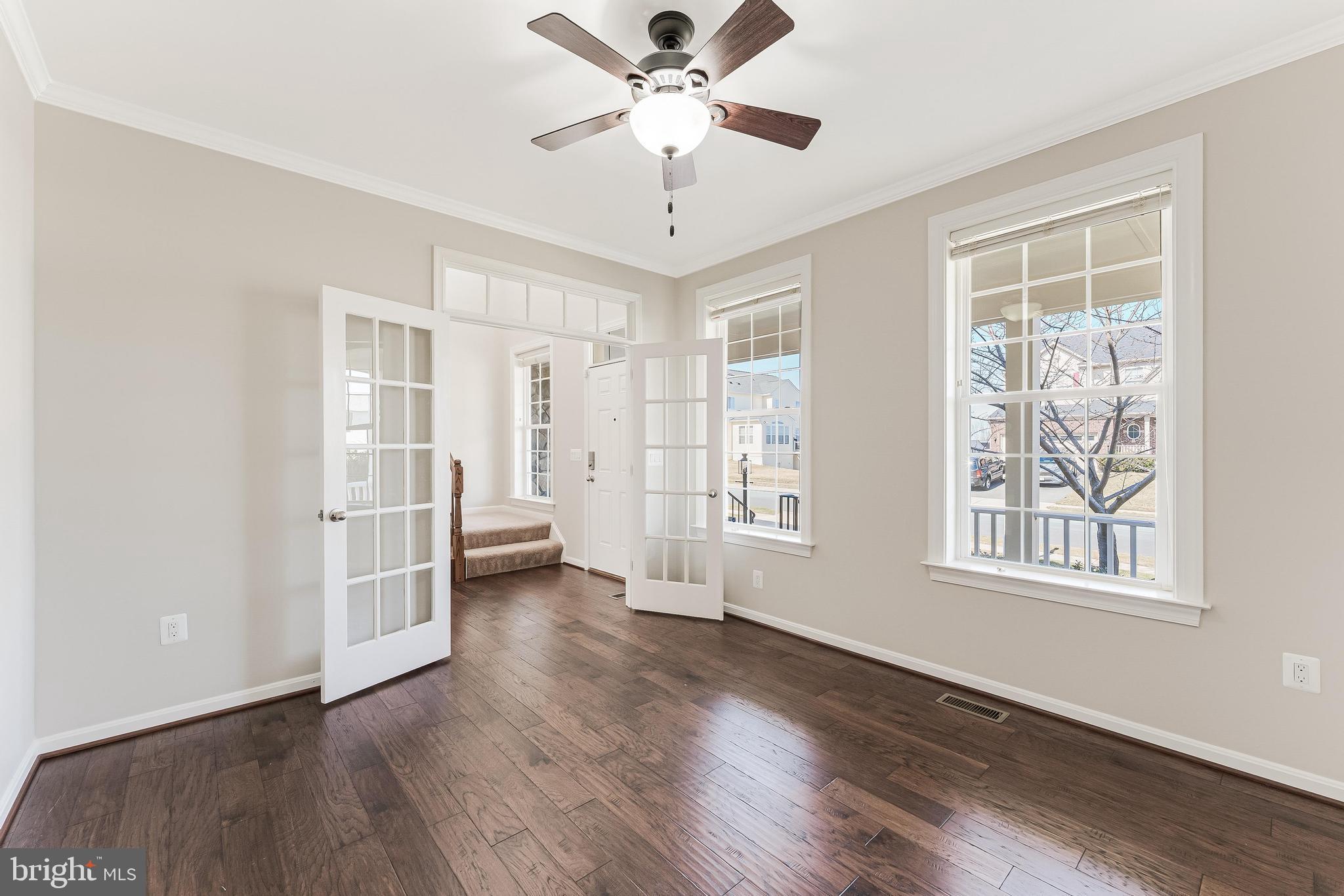 18747 Pier Trail Drive Triangle, VA 22172 - Photo 21 of 84 a view of an empty room with a window and wooden floor
