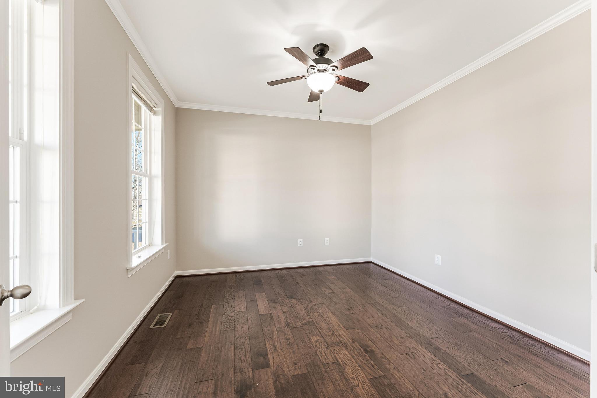 18747 Pier Trail Drive Triangle, VA 22172 - Photo 22 of 84 wooden floor in an empty room with a window