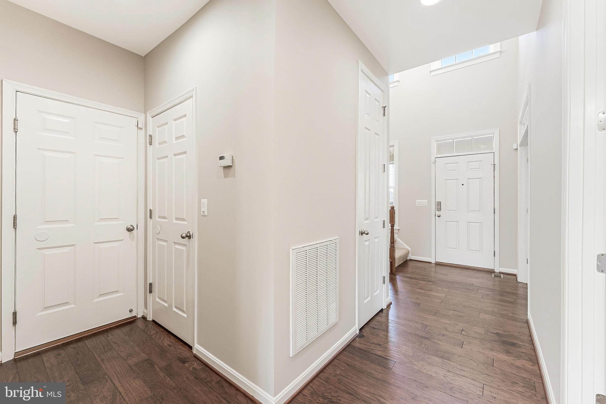 18747 Pier Trail Drive Triangle, VA 22172 - Photo 24 of 84 a view of a hallway with wooden floor