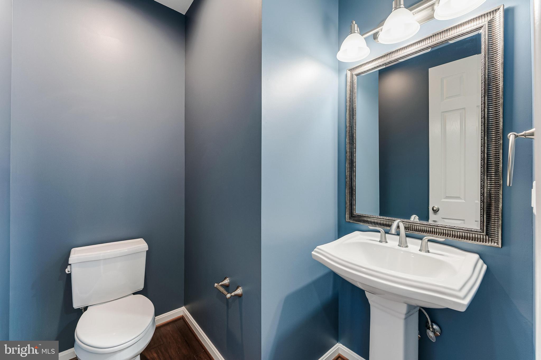 18747 Pier Trail Drive Triangle, VA 22172 - Photo 25 of 84 a bathroom with a sink toilet and mirror