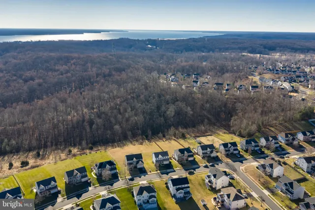 an aerial view of a house with a swimming pool yard and outdoor seating