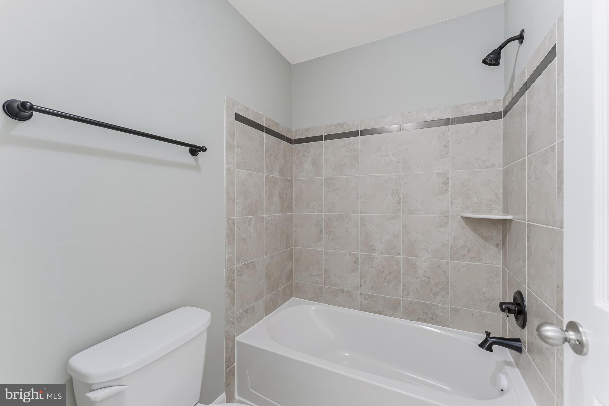 18747 Pier Trail Drive Triangle, VA 22172 - Photo 55 of 84 a bathroom with a bathtub and a toilet