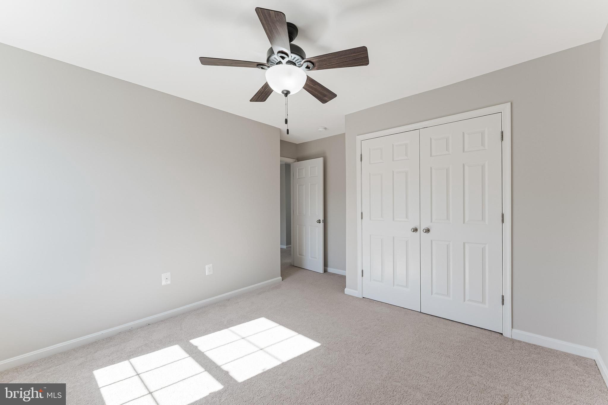 18747 Pier Trail Drive Triangle, VA 22172 - Photo 59 of 84 a view of an empty room and chandelier fan